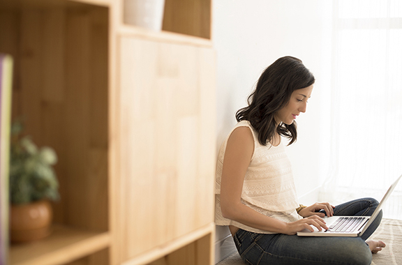 Woman with laptop exploring family history